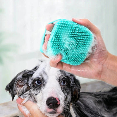 Silicone pet massager bath brush with built-in shampoo dispenser for dogs and cats, featuring soft bristles for grooming and deep cleaning.
